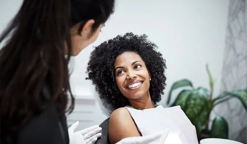 A dental patient being examined by a dentist