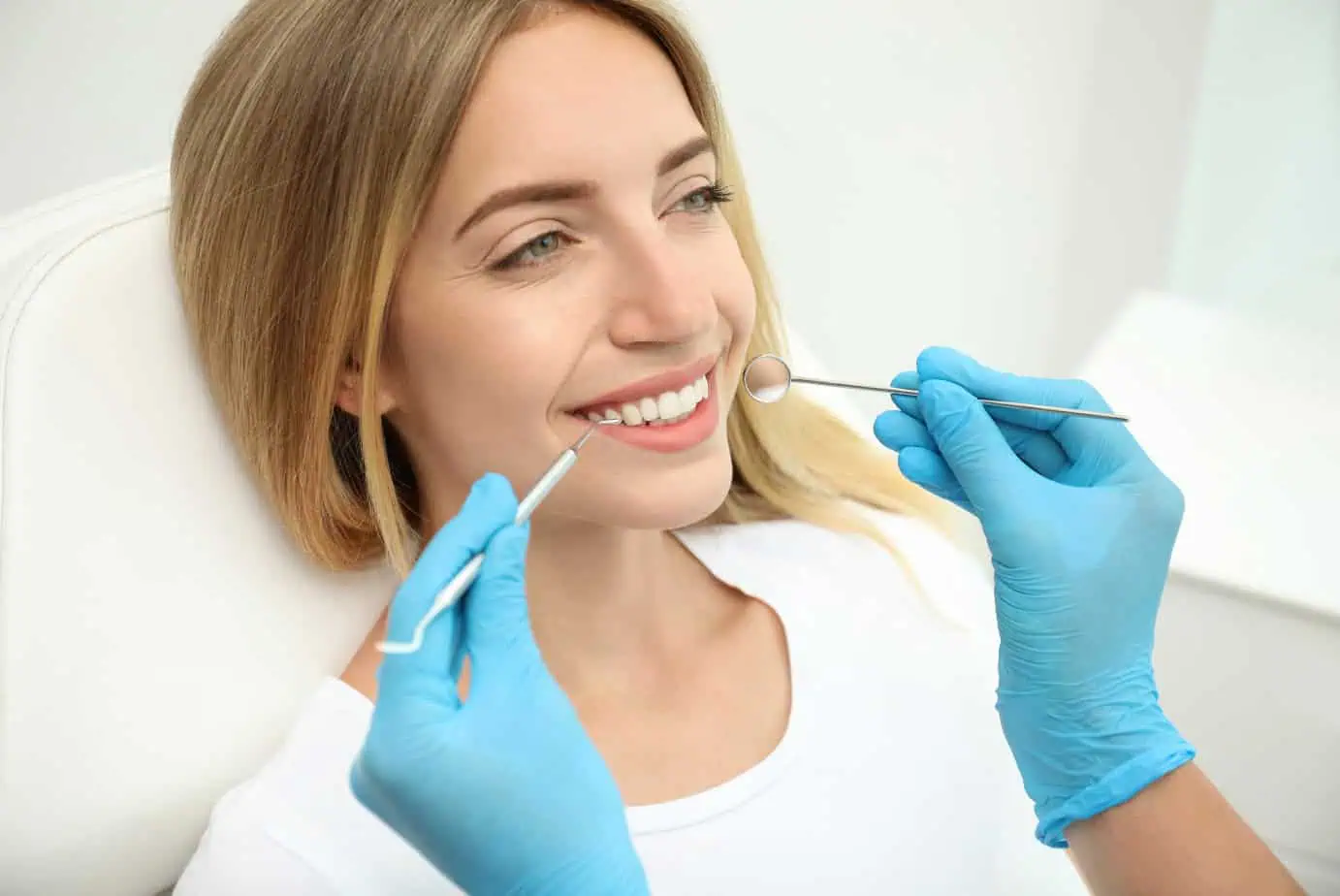 A dental patient being examined by a dentist